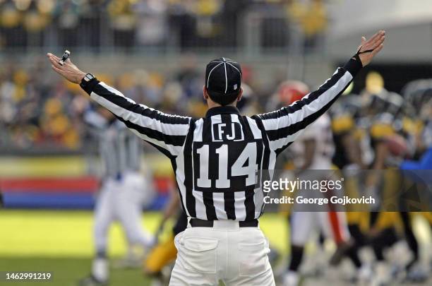 National Football League field judge Gene Steratore signals during a game between the Cincinnati Bengals and Pittsburgh Steelers at Heinz Field on...