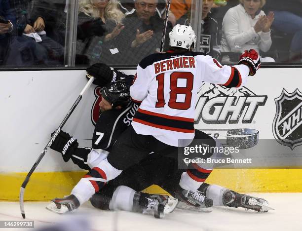 Steve Bernier of the New Jersey Devils boards Rob Scuderi of the Los Angeles Kings in the first period of Game Six of the 2012 Stanley Cup Final at...