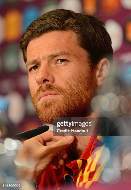 In this handout image provided by UEFA, Xabi Alonso of Spain talks to the media during a UEFA EURO 2012 press conference at the Municipal Stadium on...