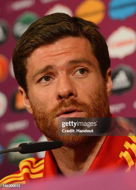 In this handout image provided by UEFA, Xabi Alonso of Spain talks to the media during a UEFA EURO 2012 press conference at the Municipal Stadium on...