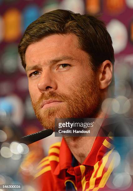 In this handout image provided by UEFA, Xabi Alonso of Spain talks to the media during a UEFA EURO 2012 press conference at the Municipal Stadium on...