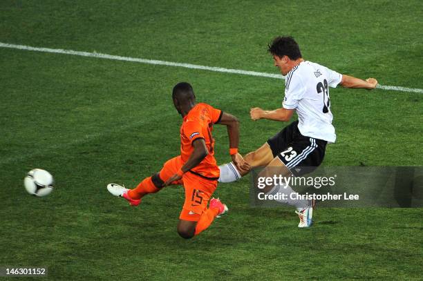 Mario Gomez of Germany scores their second goal during the UEFA EURO 2012 group B match between Netherlands and Germany at Metalist Stadium on June...