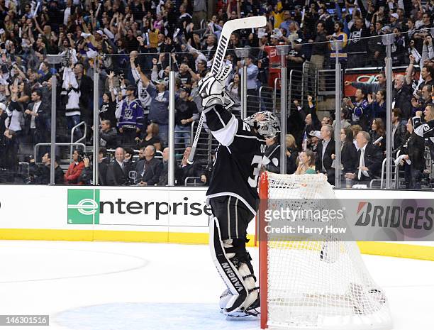 Goaltender Jonathan Quick of the Los Angeles Kings celebrates just prior to the end of the third period against the New Jersey Devils in Game Six of...