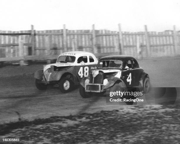 Early-1950s: Billy Myers slips to the inside of another competitor to make a pass during a Modified Stock Car race at Greensboro Agricultural...