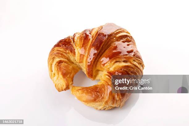 croissant on white background - croissant stockfoto's en -beelden