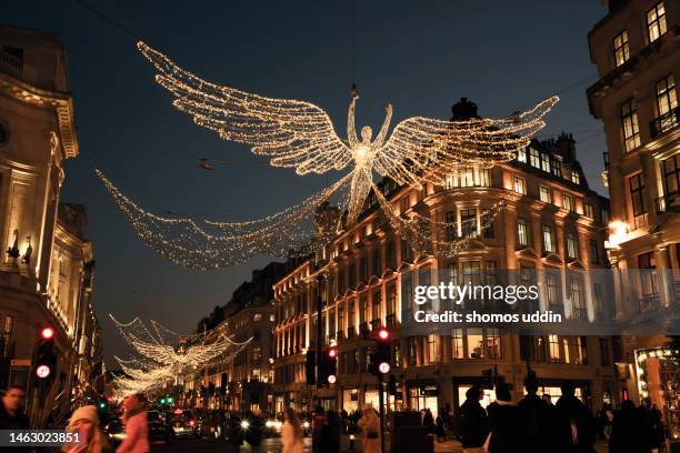 london west end in busy christmas season - regent street christmas lights stock pictures, royalty-free photos & images