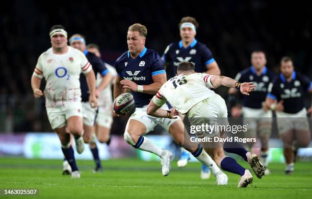 Duhan van der Merwe of Scotland goes past Freddie Steward to score his first and Scotland's second try during the Six Nations Rugby match between...