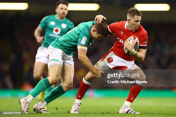 Liam Williams of Wales hands off Garry Ringrose of Ireland during the Six Nations Rugby match between Wales and Ireland at Principality Stadium on...