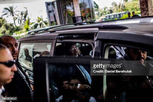 Egyptian presidential candidate Mohamed Morsi of the Muslim Brotherhood departs after speaking at a press conference on June 13, 2012 in Cairo,...