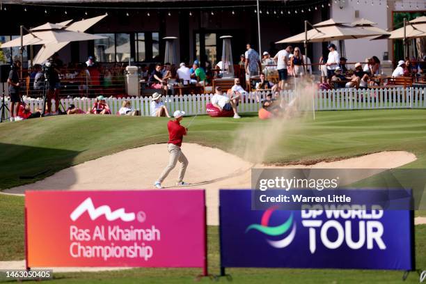 Adrian Meronk of Poland plays his bunker shot on the 18th hole on Day Four of the Ras Al Khaimah Championship at Al Hamra Golf Club on February 05,...