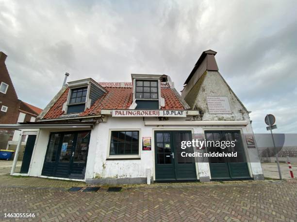 eel industry in volendam - monument stock pictures, royalty-free photos & images