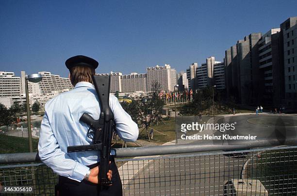Israeli Hostage Crisis: 1972 Summer Olympics: Rear view of police officer with gun, rifle during crisis at 31 Connollystrasse in Olympic Village. 11...