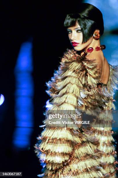Adriana Lima walks the runway at the Paco Rabanne Haute Couture Fall/Winter 1999-2000 fashion show during the Paris Fashion Week in July, 1999 in...