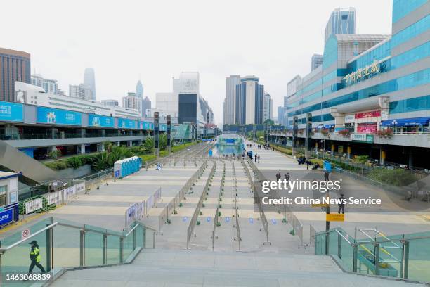 People walk on the square of Luohu Port on February 5, 2023 in Shenzhen, Guangdong Province of China. Luohu Port is a port of border crossing between...