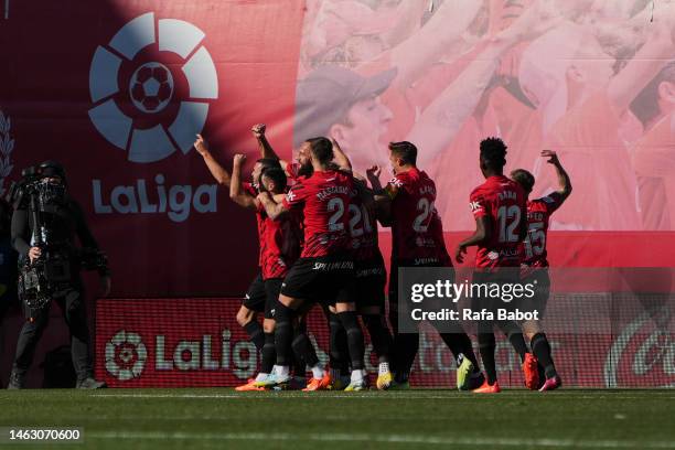 Vedat Muriqi of RCD Mallorca celebrates scoring his team's first goal with teammates during the LaLiga Santander match between RCD Mallorca and Real...