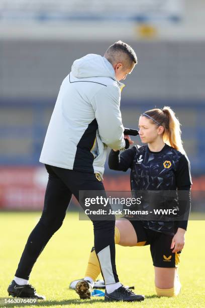 Daniel McNamara, Head Coach of Wolverhampton Wanderers embraces Laura Cooper of Wolverhampton Wanderers ahead of the Women's National League Cup...