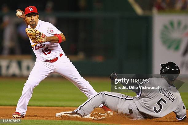 Rafael Furcal of the St. Louis Cardinals turns a double play over Orlando Hudson of the Chicago White Sox at Busch Stadium on June 13, 2012 in St....