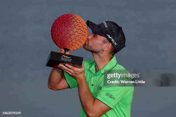 Daniel Gavins of England poses with the Ras Al Khaimah Championship trophy on Day Four of the Ras Al Khaimah Championship at Al Hamra Golf Club on...