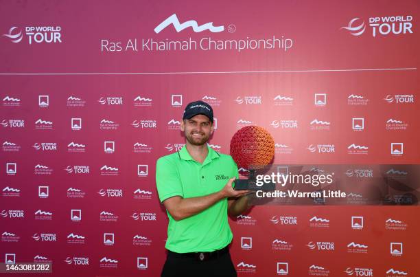 Daniel Gavins of England poses with the Ras Al Khaimah Championship trophy on Day Four of the Ras Al Khaimah Championship at Al Hamra Golf Club on...