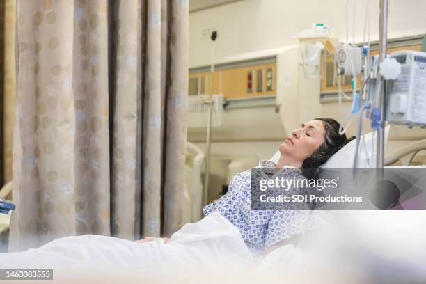 unconscious female patient in recovery room after surgery - unconscious stock pictures, royalty-free photos & images