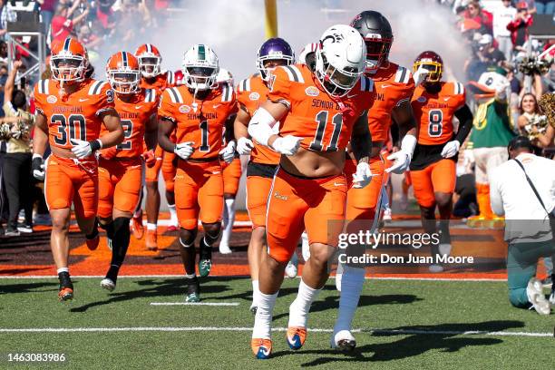 Linebacker Ivan Pace, Jr. #11 of Cincinnati from the National Team leads his team onto the field before the start of the 2023 Resse's Senior Bowl at...