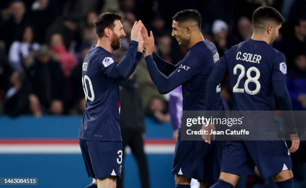 Lionel Messi of PSG celebrates his goal with Achraf Hakimi during the Ligue 1 match between Paris Saint-Germain and Toulouse FC at Parc des Princes...