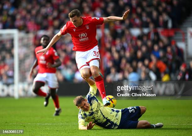 Chris Wood of Nottingham Forest battles for possession with Maximilian Woeber of Leeds United during the Premier League match between Nottingham...