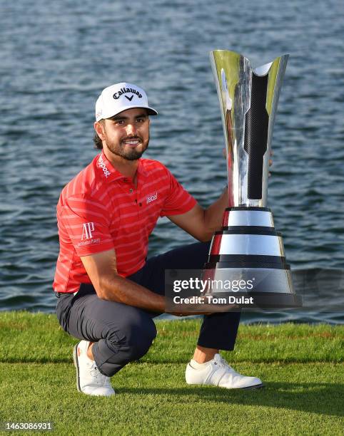 Abraham Ancer of Mexico poses with the trophy after winning the PIF Saudi International at Royal Greens Golf & Country Club on February 05, 2023 in...