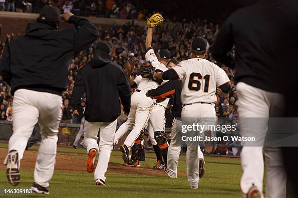 Matt Cain of the San Francisco Giants celebrates after pitching a perfect game against the Houston Astros at AT&T Park on June 13, 2012 in San...