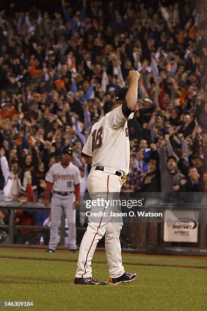 Matt Cain of the San Francisco Giants celebrates after pitching a perfect game against the Houston Astros at AT&T Park on June 13, 2012 in San...