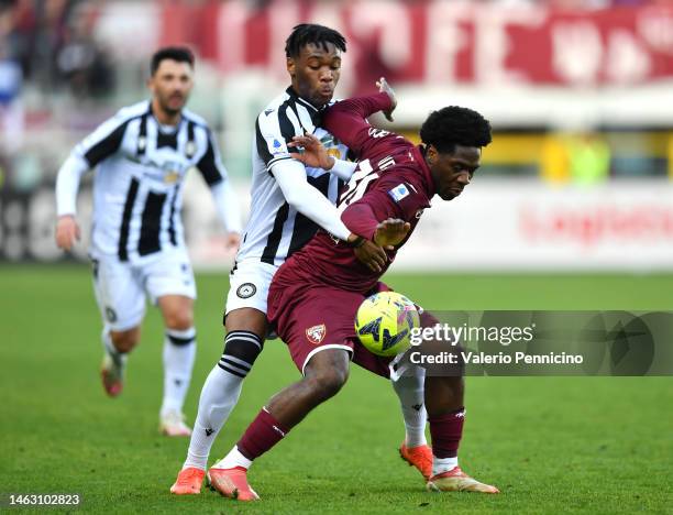 Ola Aina of Torino FC battles for possession with Destiny Udogie of Udinese Calcio during the Serie A match between Torino FC and Udinese Calcio at...