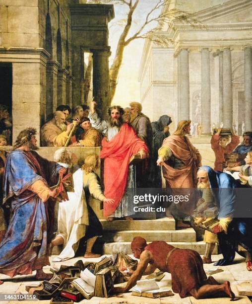 burning of pagan books by saint paul in ephesus, people standing around the fire - st paul stock illustrations