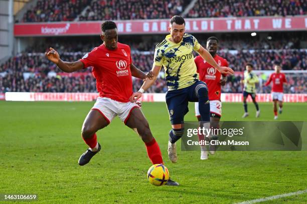 Willy Boly of Nottingham Forest battles for possession with Jack Harrison of Leeds United during the Premier League match between Nottingham Forest...