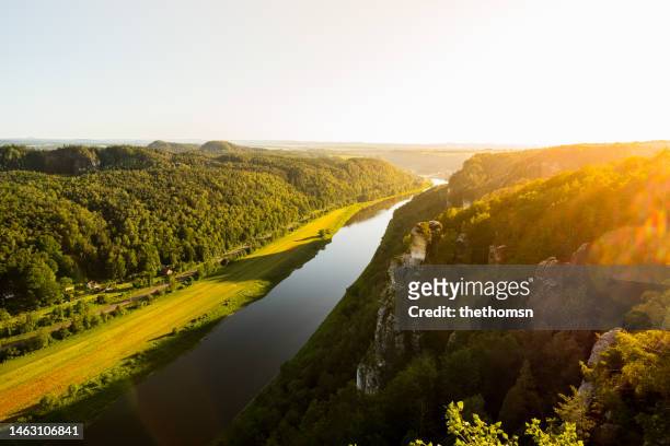 river elbe during sunset,  saxon switzerland national park, saxony, germany - elbe river stock pictures, royalty-free photos & images