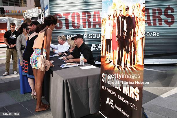 Dan Dotson, Laura Dotson and Dave Hester attend A&E's 'Storage Wars' Lockbuster Tour at Nokia Plaza L.A. LIVE on June 13, 2012 in Los Angeles,...