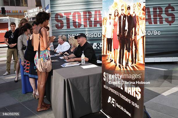 Dan Dotson, Laura Dotson and Dave Hester attend A&E's 'Storage Wars' Lockbuster Tour at Nokia Plaza L.A. LIVE on June 13, 2012 in Los Angeles,...