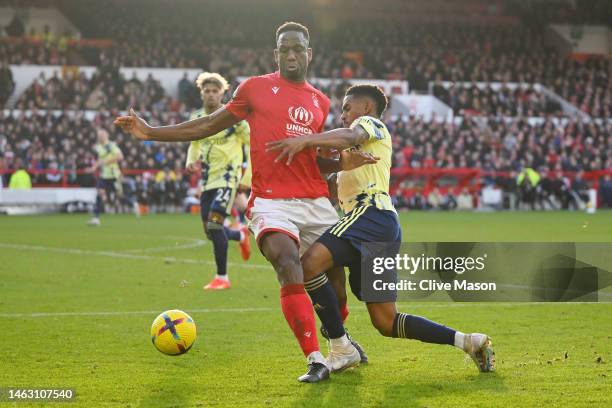 Willy Boly of Nottingham Forest battles for possession with Junior Firpo of Leeds United during the Premier League match between Nottingham Forest...