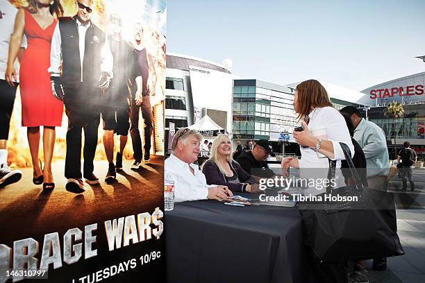 Dan Dotson, Laura Dotson and Dave Hester attend A&E's 'Storage Wars' Lockbuster Tour at Nokia Plaza L.A. LIVE on June 13, 2012 in Los Angeles,...