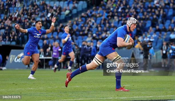 Thibaud Flament of France dives over for their first try during the Six Nations Rugby match between Italy and France at Stadio Olimpico on February...