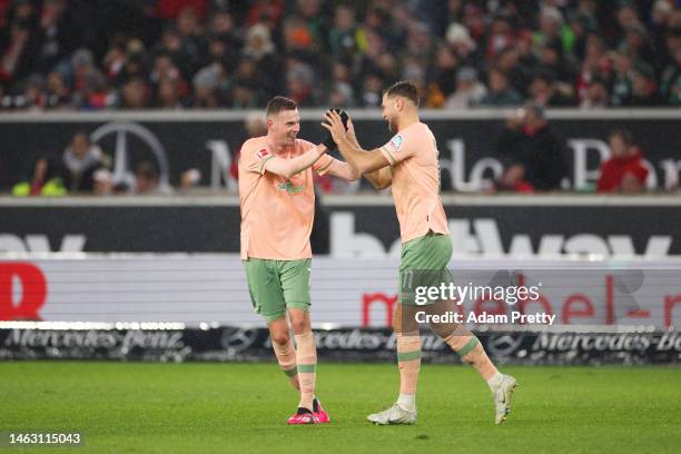 Marvin Ducksch of SV Werder Bremen celebrates with teammate Niclas Fuellkrug after scoring the team's second goal during the Bundesliga match between...