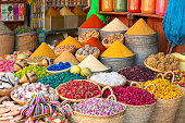 Colorful spices and dyes found at souk market in Marrakesh, Morocco.