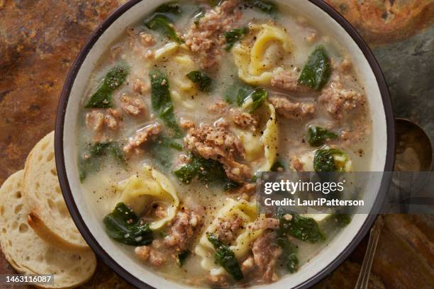 creamy cheese tortellini with spicy italian sausage soup - tortellini stock pictures, royalty-free photos & images