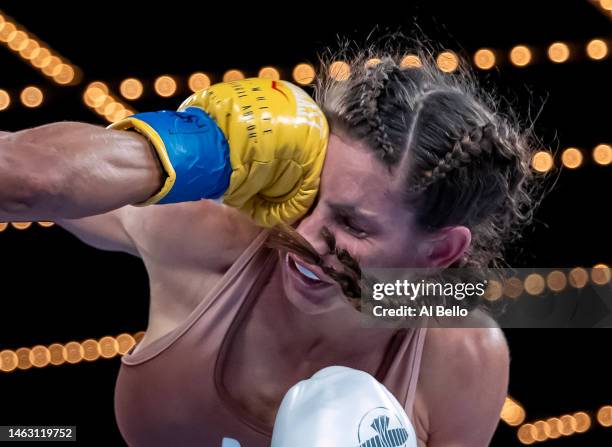 Ramla Ali exchanges punches Avril Mathie during their women's junior featherweight fight at The Hulu Theater at Madison Square Garden on February 04,...