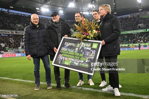 Joerg Schmadtke, Director of Sport for VfL Wolfsburg is presented with a gift at half time during the Bundesliga match between VfL Wolfsburg and FC...