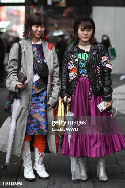 An atendee of Tokyo Fashion Week AW 2018 stops for a street style photograph.