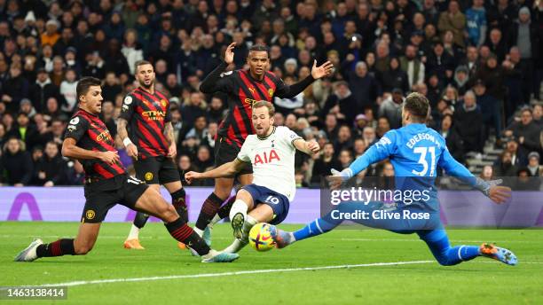 Harry Kane of Tottenham Hotspur has a shot saved by Ederson of Manchester City during the Premier League match between Tottenham Hotspur and...