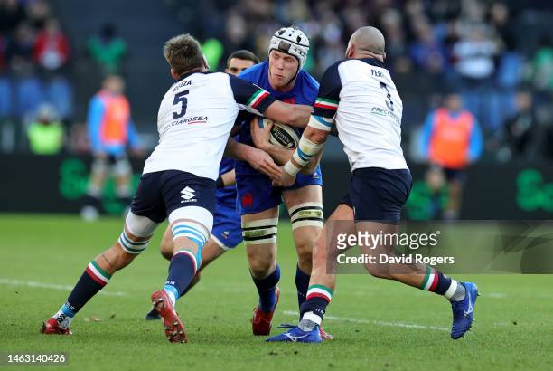 Thibaud Flament of France is tackled by Federico Ruzza and Simone Ferrari during the Six Nations Rugby match between Italy and France at Stadio...