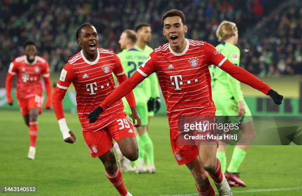 Jamal Musiala of Bayern Munich celebrates after scoring the team's fourth goal during the Bundesliga match between VfL Wolfsburg and FC Bayern...