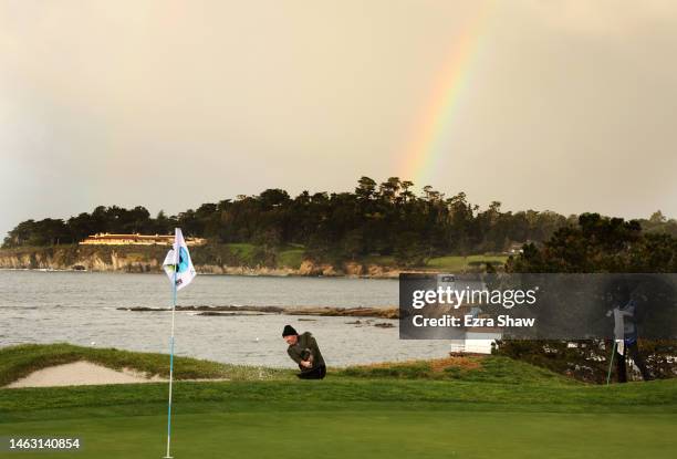 Joe Horowitz of the United States plays a shot from a bunker on the fourth hole during a continuation of the third round of the AT&T Pebble Beach...