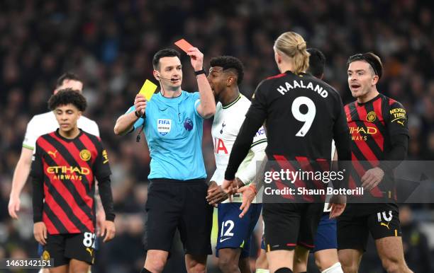 Referee Andy Madley shows a red card to Cristian Romero of Tottenham Hotspur during the Premier League match between Tottenham Hotspur and Manchester...